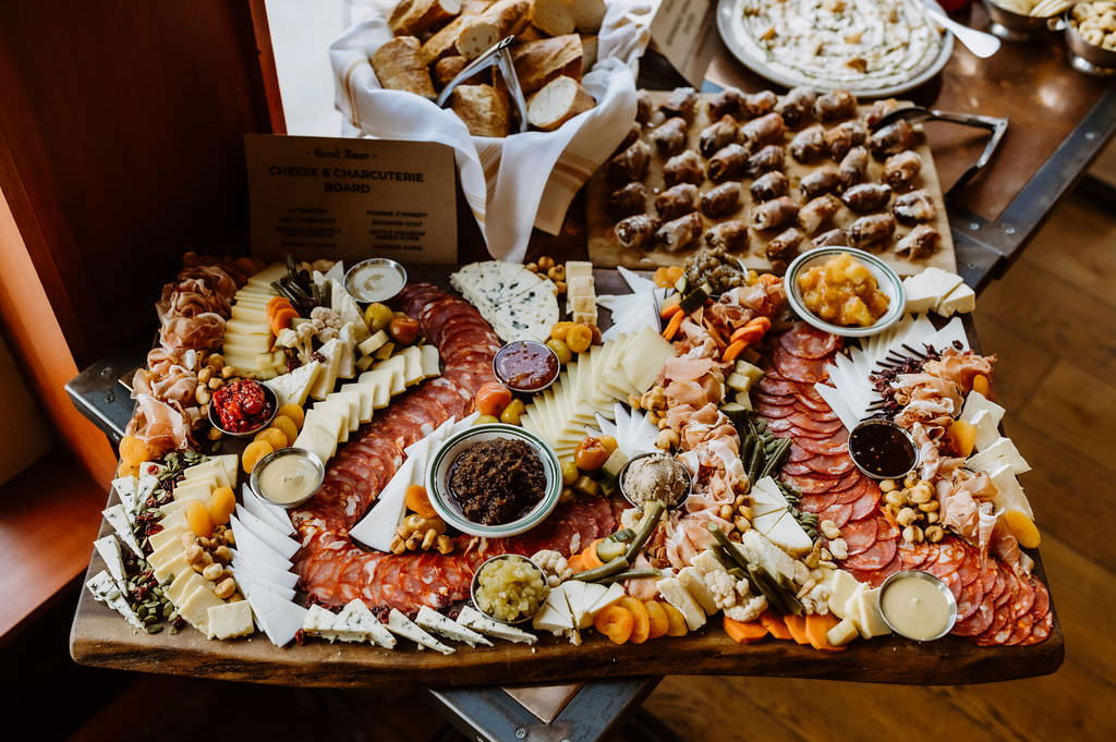 A large charcuterie board with meats and cheeses 