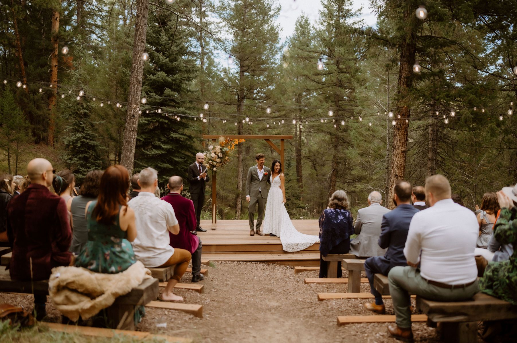 a couple having their wedding ceremony at Juniper Mountain House in Evergreen Colorado 